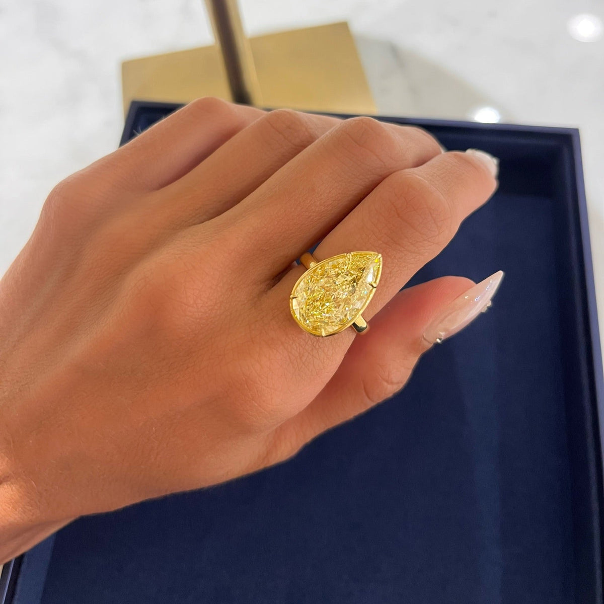 10.02ct Natural Fancy Yellow Pear Diamond in a Bezel Set Solitaire Setting