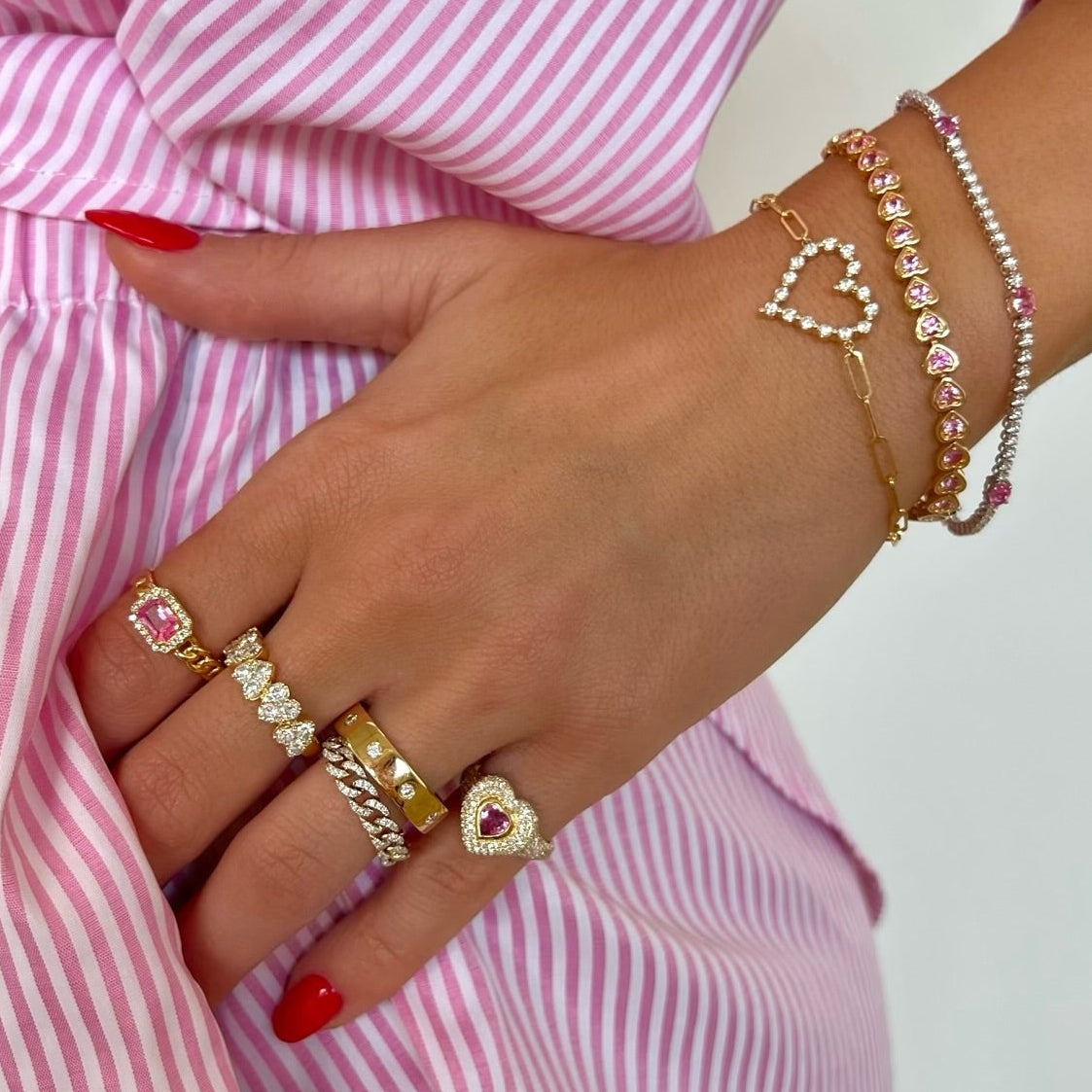 Vita Diamond Heart Ring 1.60 ctw, Aster Pink Sapphire Chain Link Ring, Mama Heart Pave Diamond Signet Ring 1.00 ctw, Amour Diamond Station Cigar Band, Little Posie Charlie Cloud® Floating Diamond Heart Bracelet 0.56 ctw, Paxton Pink Sapphire Heart Adjustable Tennis Bracelet 2.83 ctw, Bellamy Pink Sapphire Hearts & Diamond Bezel Adjustable Tennis Bracelet 3.10 ctw