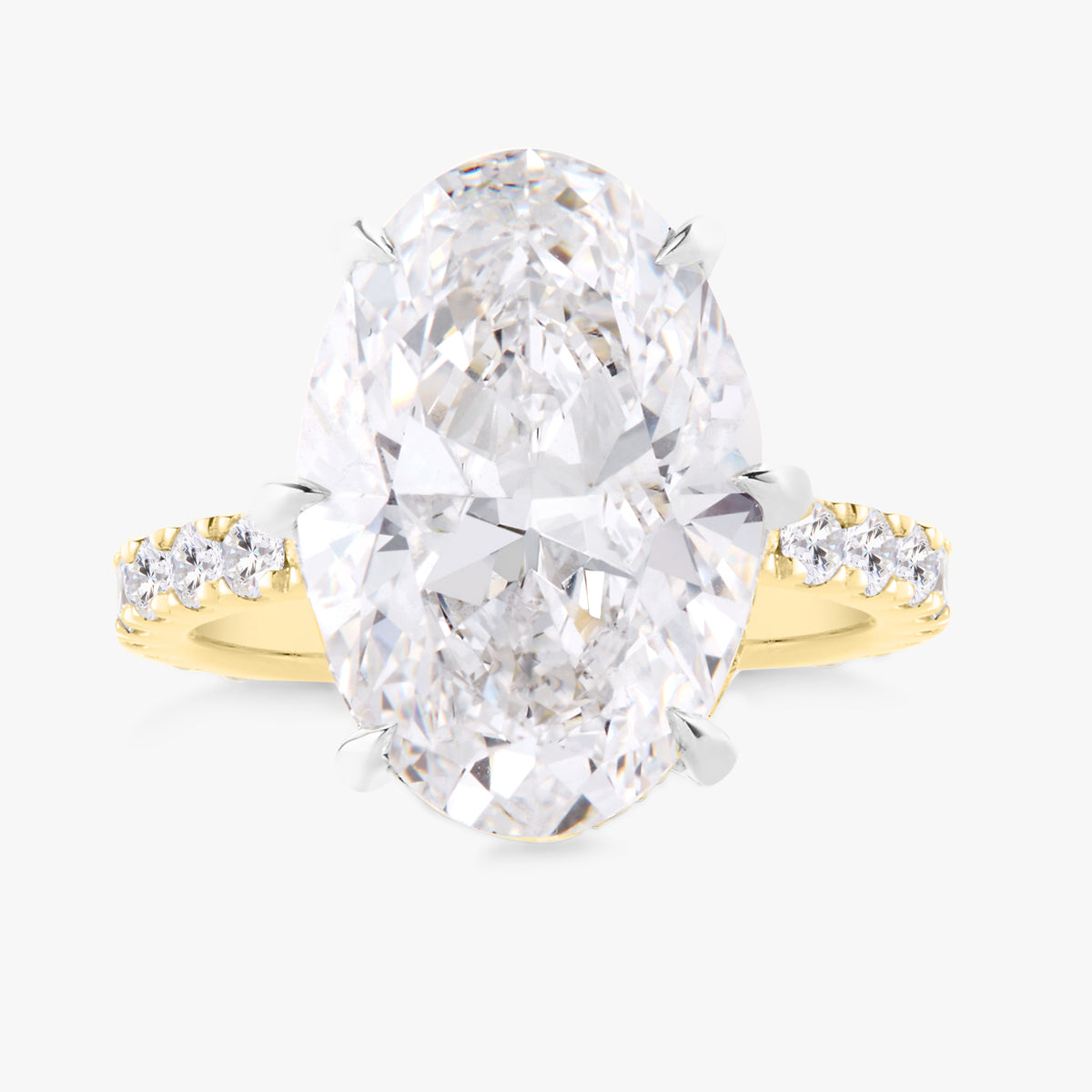 7.14ct Lab Grown Oval Diamond in a Pavé Solitaire with Hidden Halo and Diamonds on the Prongs