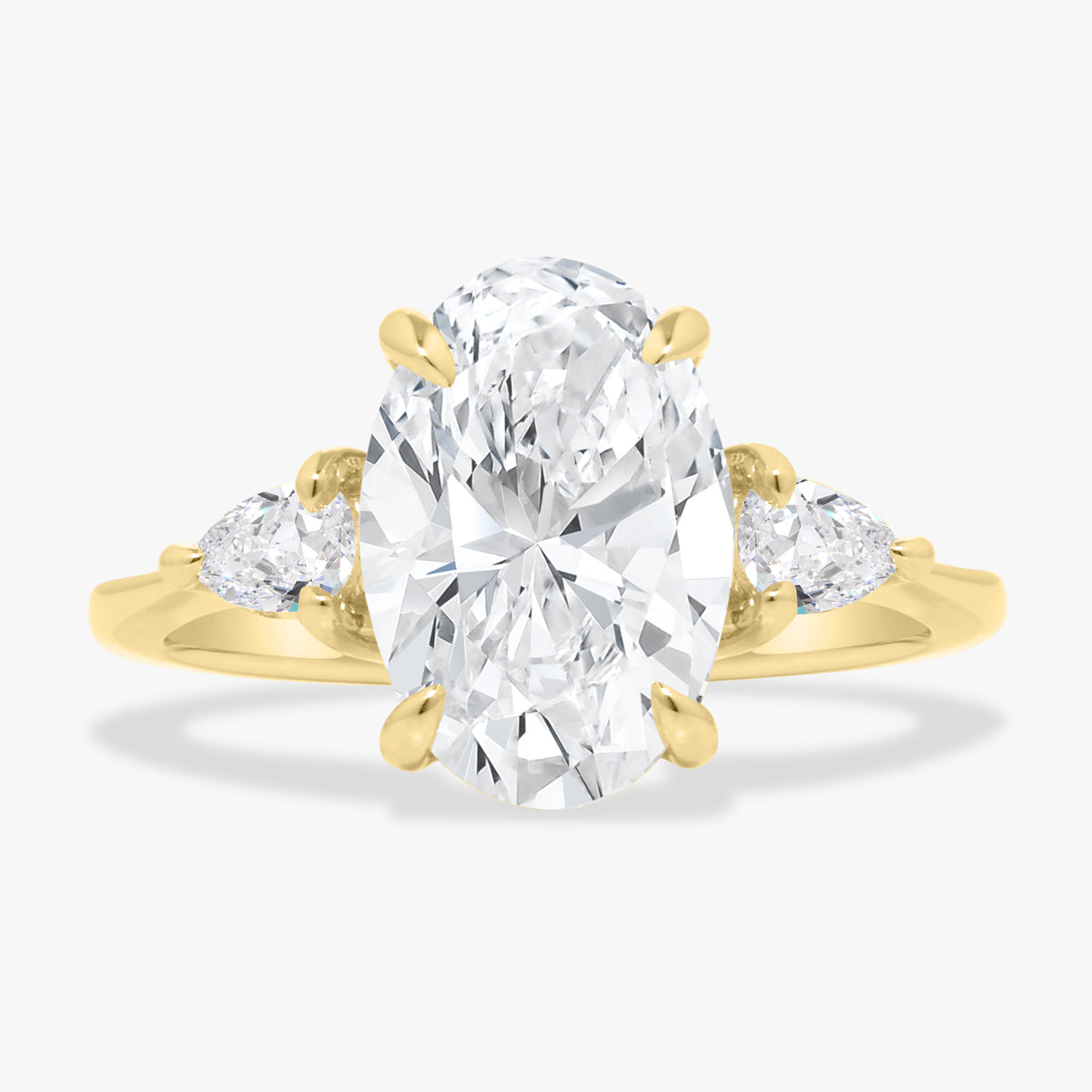 3.06ct Lab Grown Oval Diamond in a Three Stone Pear Setting