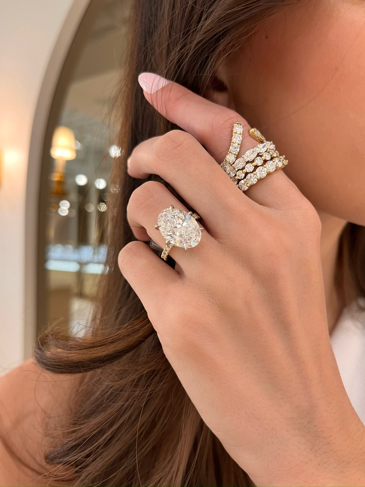 7.14ct Lab Grown Oval Diamond in a Pavé Solitaire with Hidden Halo and Diamonds on the Prongs