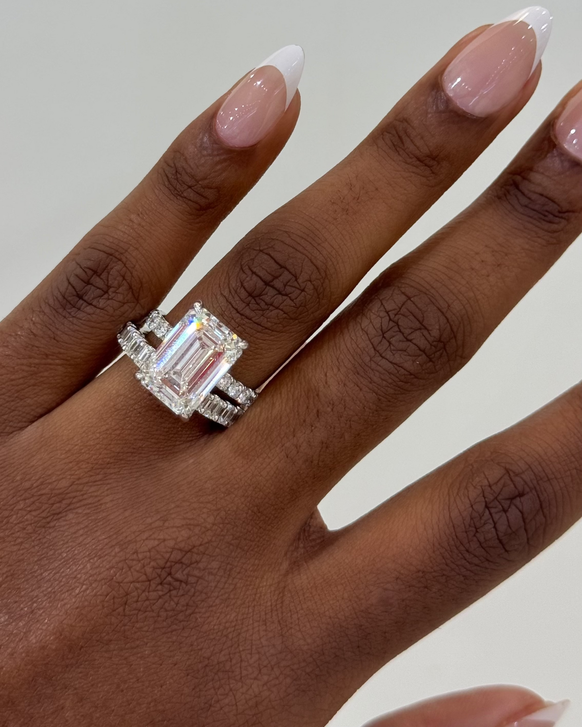 7.09ct Lab Grown Emerald Cut Diamond in a Solitaire Setting with a Pavé band