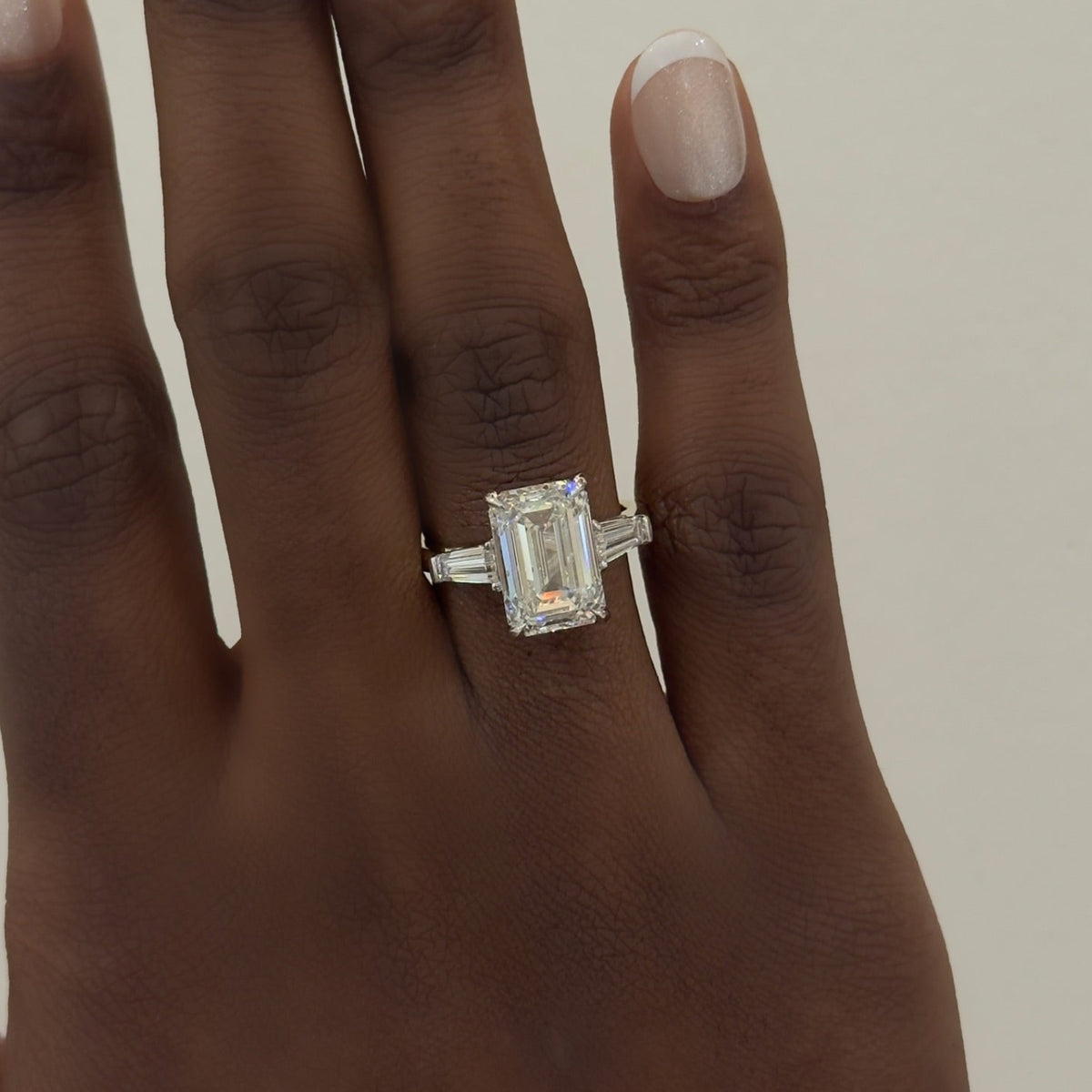 5.00ct Lab Grown Emerald Diamond in a Three-Stone Setting with Tapered Baguettes