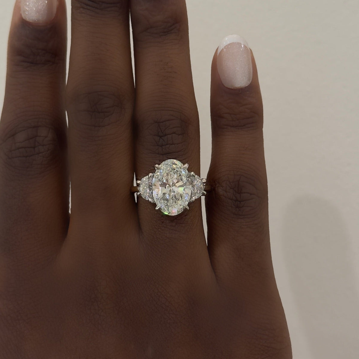 4.71ct Lab Grown Oval Diamond in a Half Moon Setting with Hidden Halos