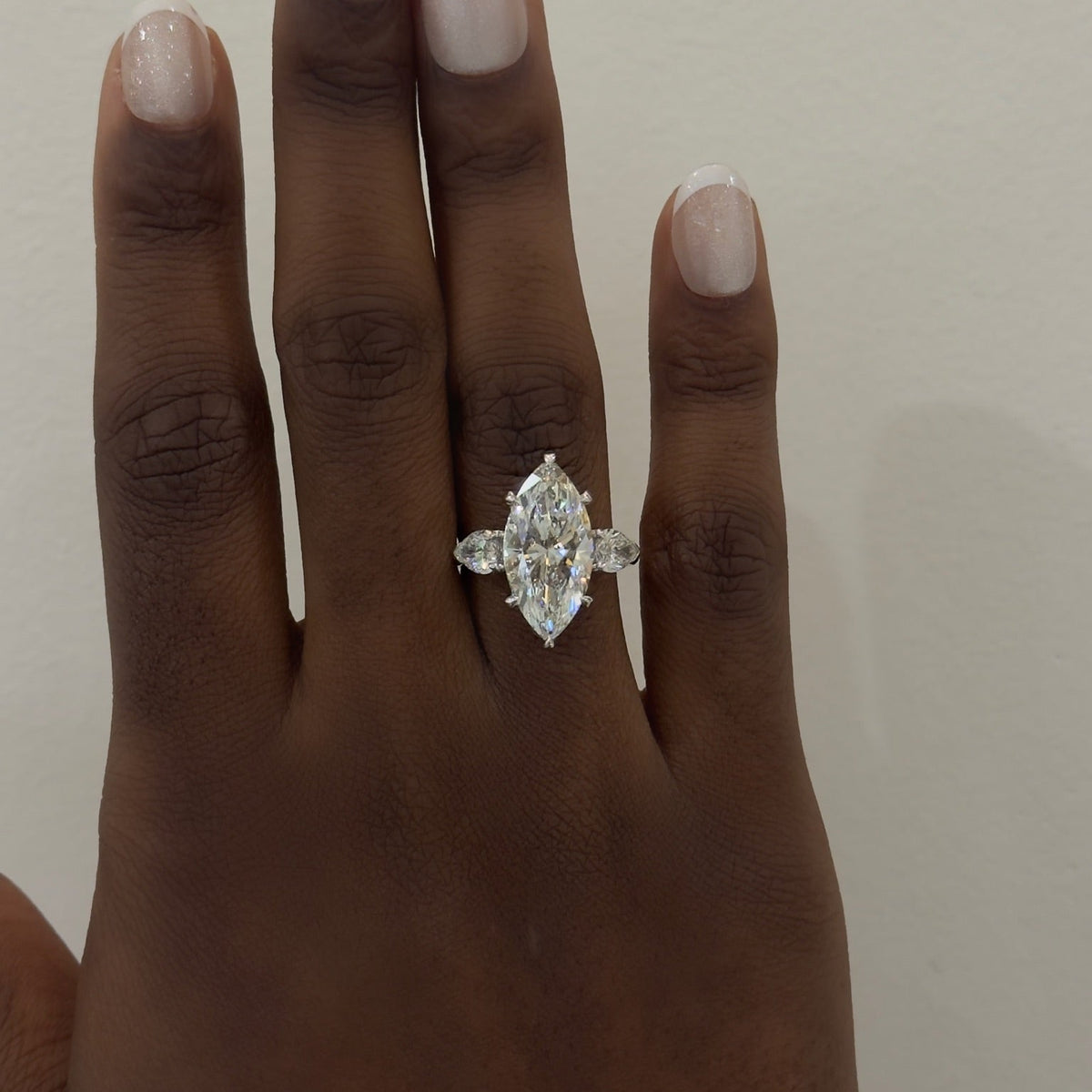 5.09ct Lab Grown Marquise Diamond in a Three-Stone Setting with Pear sides and Diamonds on the Prongs