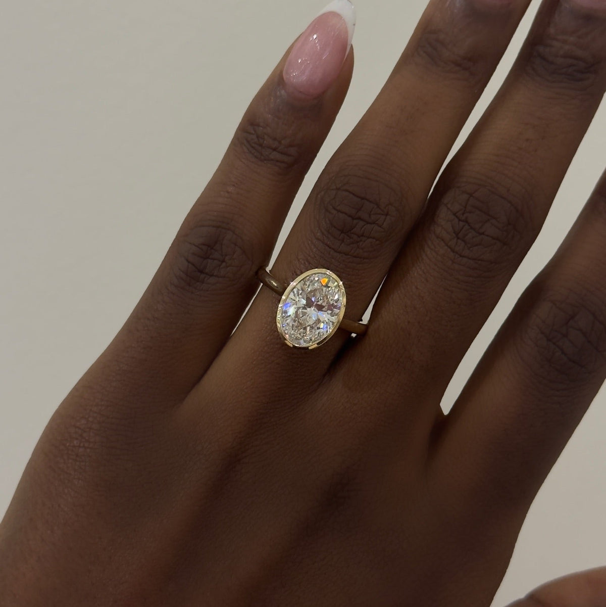 3.03ct Lab Grown Oval Diamond in a Solitaire Full-Bezel Setting