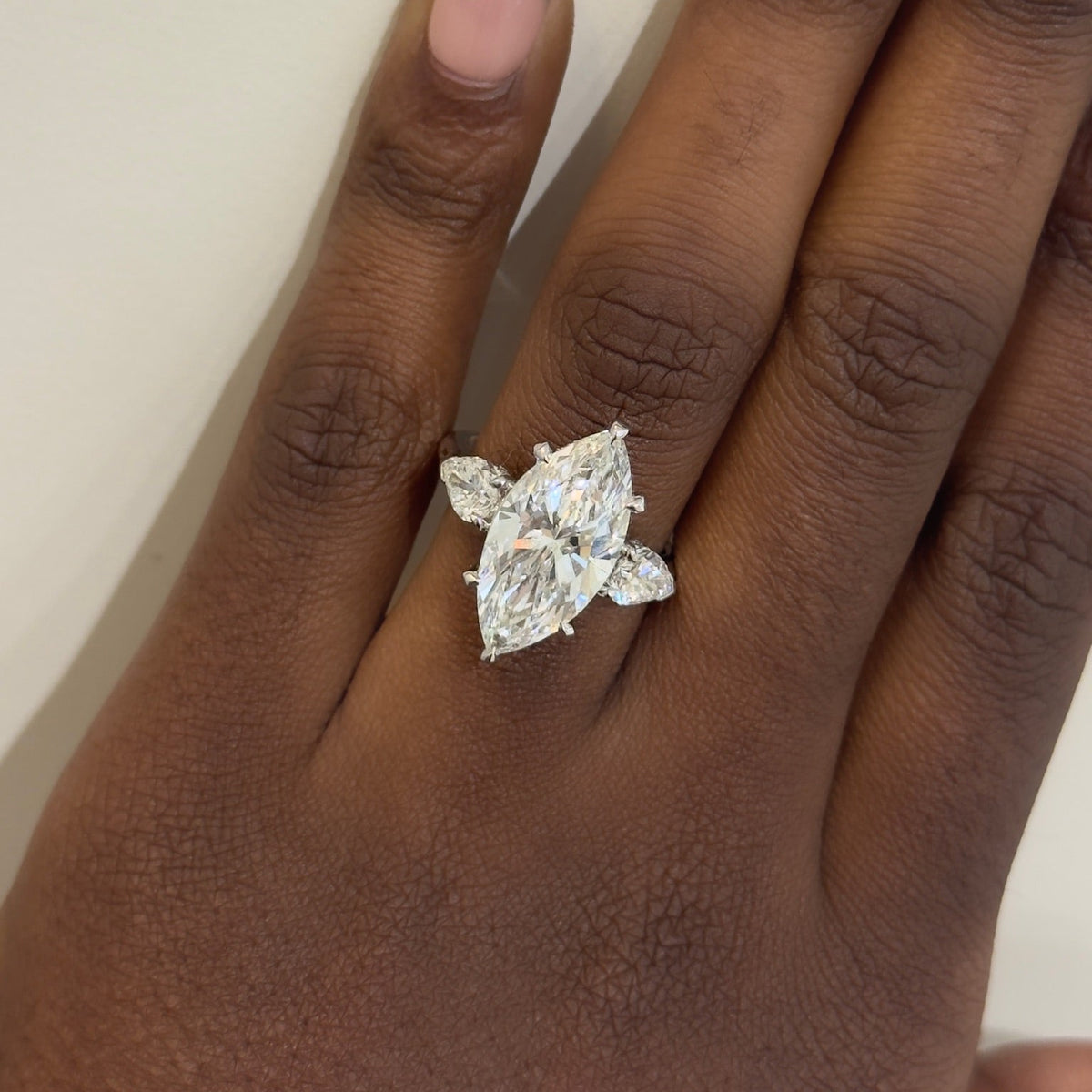 5.09ct Lab Grown Marquise Diamond in a Three-Stone Setting with Pear sides and Diamonds on the Prongs