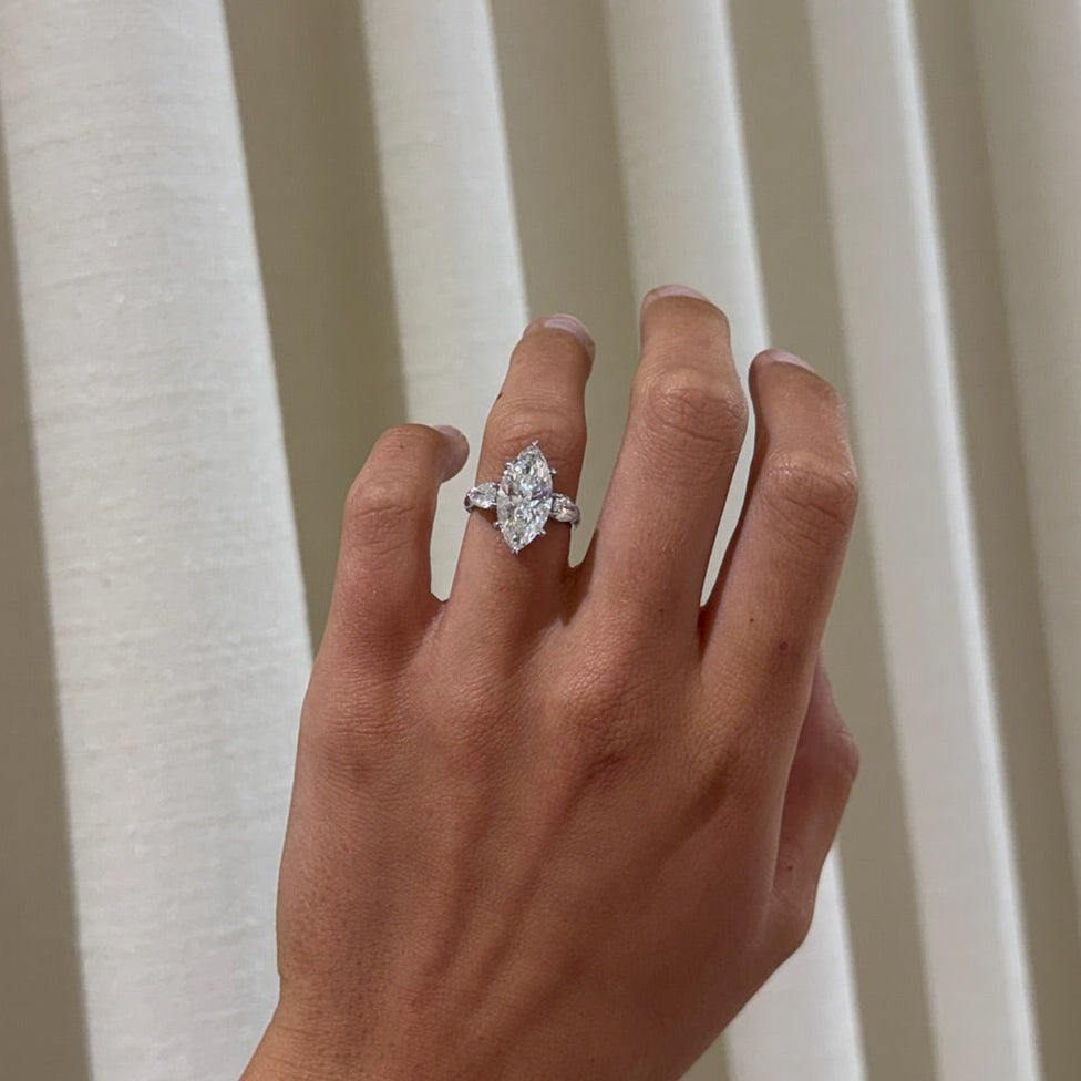 5.09ct Lab Grown Marquise Diamond in a Three-Stone Setting with Pear sides and Diamonds on the Prongs