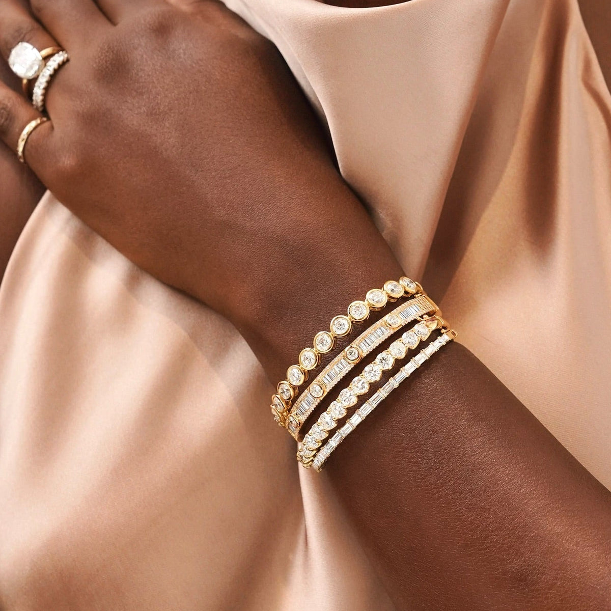 Lennox Baguette Bangle 3.37 ctw, Round Diamond Bezel Bangle Bracelet 6.05 ctw, Richards Emerald Cut Diamond Bangle Bracelet 4.00 ctw, Georgie Diamond Bangle Bracelets

