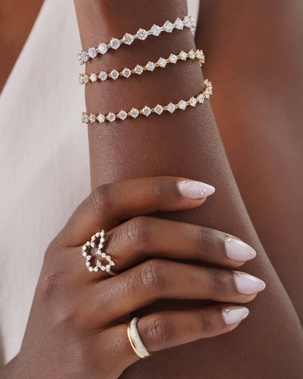 Mama's Charlie Cloud® Tennis Bracelet 11 ctw, Mama's Charlie Cloud® Bangle 4.80 ctw, The Charlie Cloud® Multi-Way Floating Diamond Tennis Bracelet , Two tone ring, and Charlie Cloud® butterfly ring

 