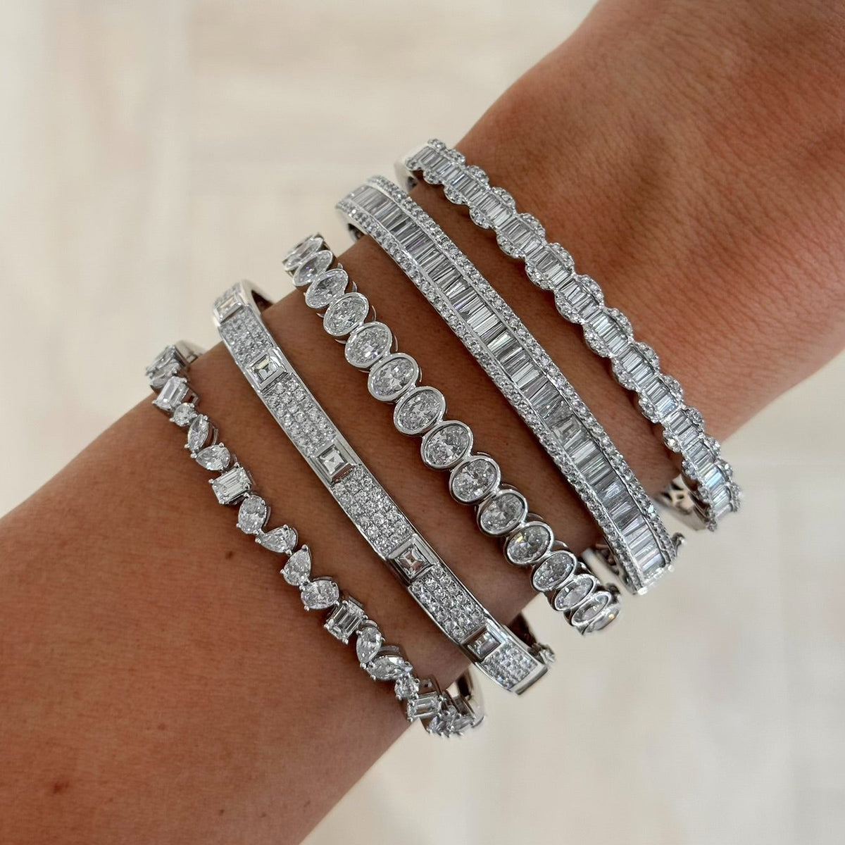 Brooks Tapered Baguette Diamond Bangle 5.10 ctw, Lilium Tapered Baguette Diamond Bangle 2.10 ctw, Azalea Pave Diamond Bangle Bracelet 2.26 ctw
Kehlani Multi Mixed Shape Diamond Bangle Bracelet 3.08 ctw
Oval Bezel Diamond Bangle Bracelet 5.35 ctw
