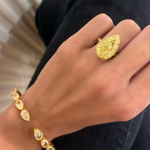 10.02ct Natural Fancy Yellow Pear Diamond in a Bezel Set Solitaire Setting