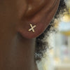 initial studs X