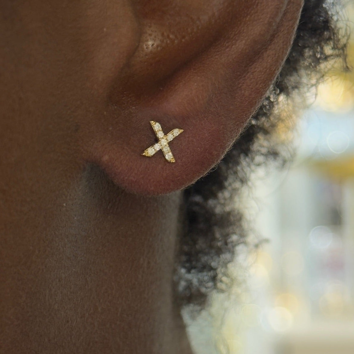 initial studs X