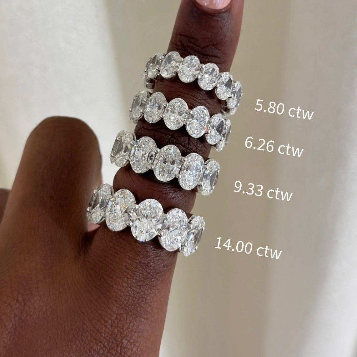 scalloped oval diamond bands: 5.80 ctw, 6.26 ctw, 9.33 ctw, 14.00 ctw 