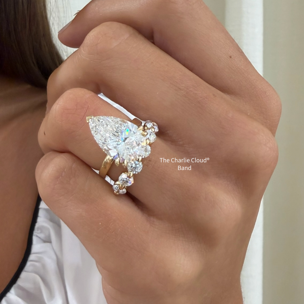 the Charlie Cloud®  YG diamond band with a pear diamond engagement ring 