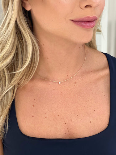 Annabelle Tiny Single Diamond Pendant Necklace on model